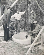 Members building a well around 1960